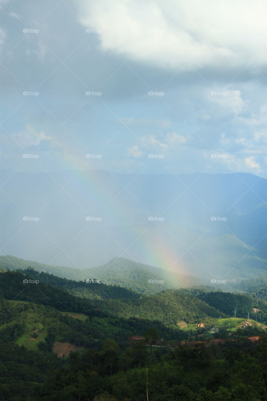 After the rain. Rainbow in nature.