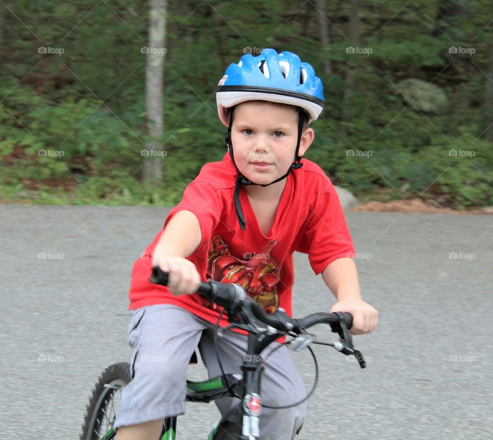 Young boy riding bicycle 