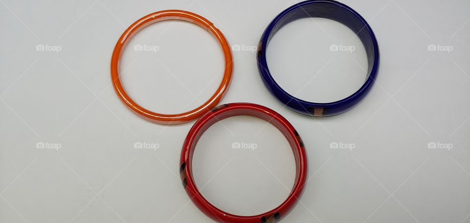 THREE BANGLES ISOLATED ON A WHITE BACKGROUND