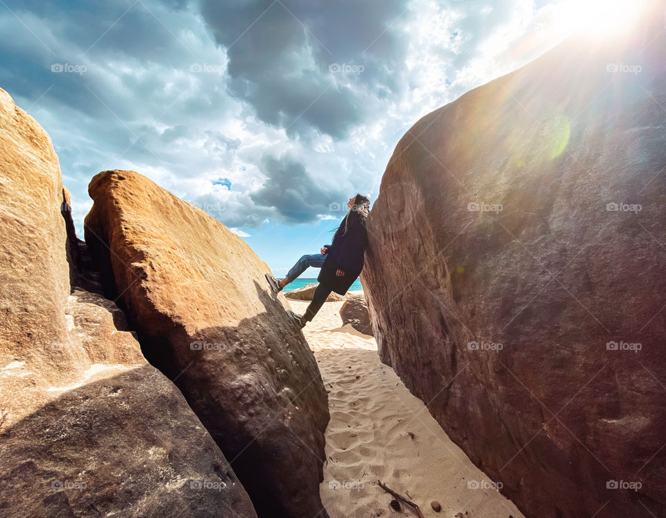 Girl between rocks