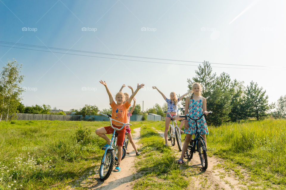 Kids riding bikes on the countryside