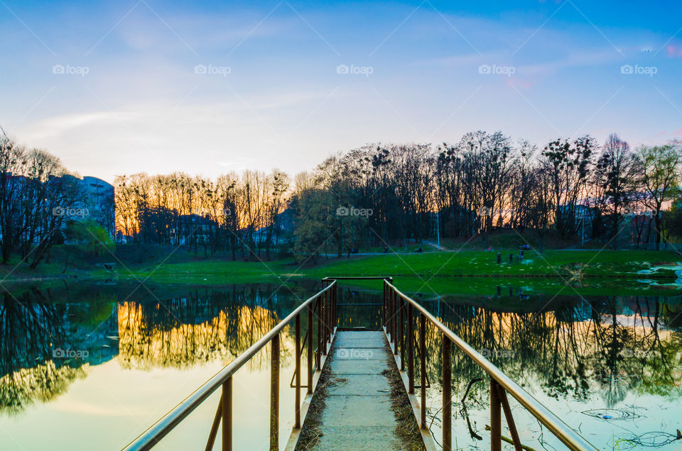 city park with lake in the spring season