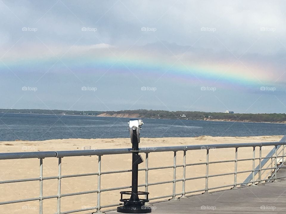 A Rainbow at the beach after a rain storm.