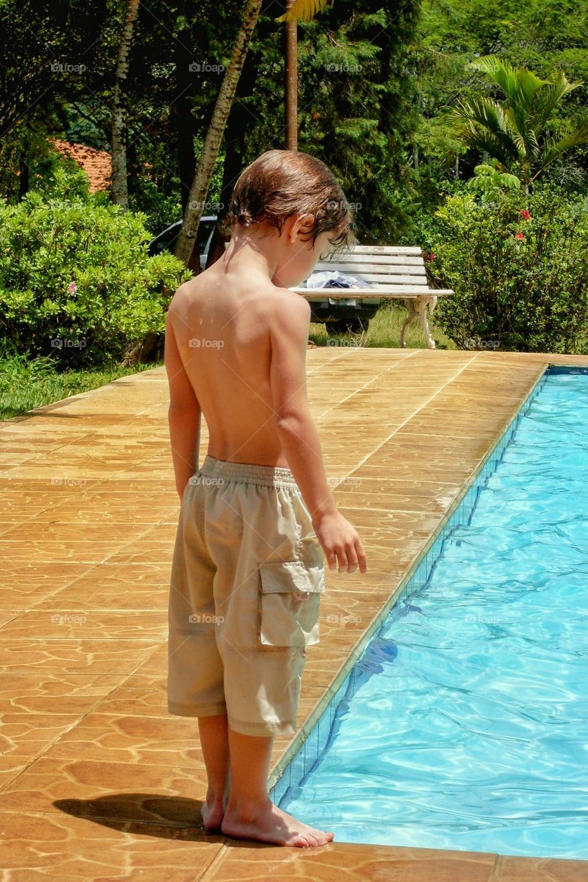 Boy by the pool
