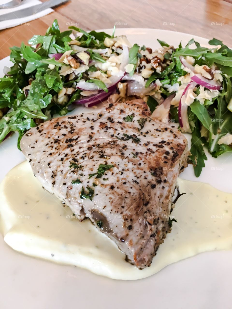 Grilled tuna steak on plate closeup