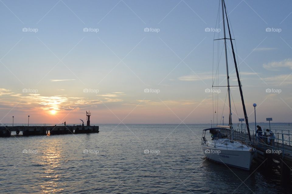 sailboats at sunset in the sea