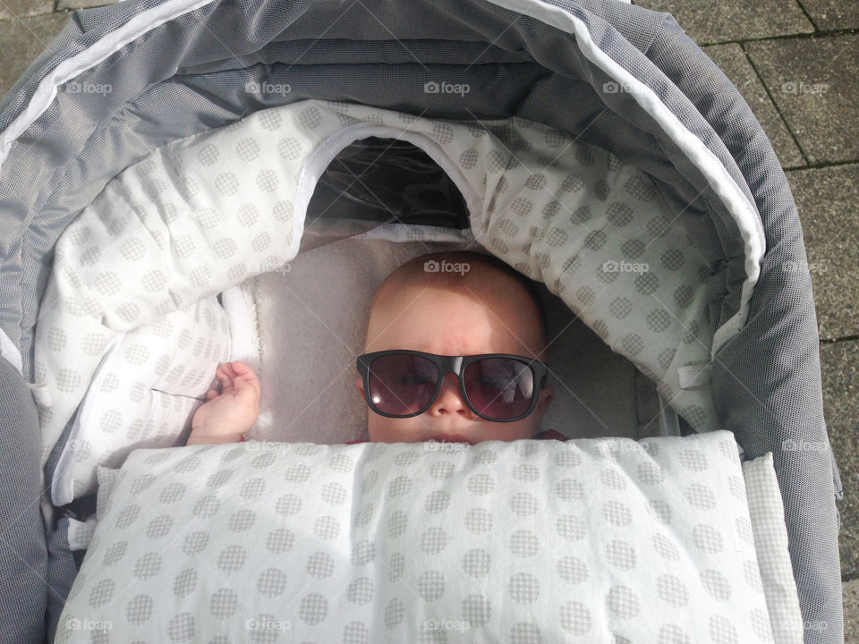 High angle view of cute boy with sunglass