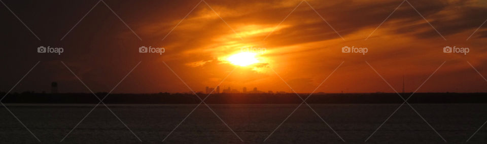 Orange sunset over city. Orange sunset over city
