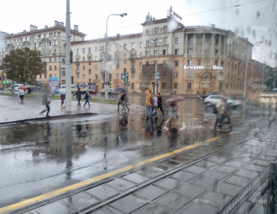 street roads view and people walking in the rainy weather