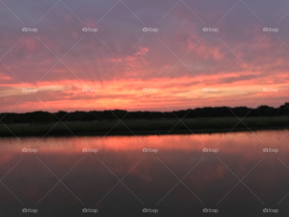 Mauve sunset on a country pond. 