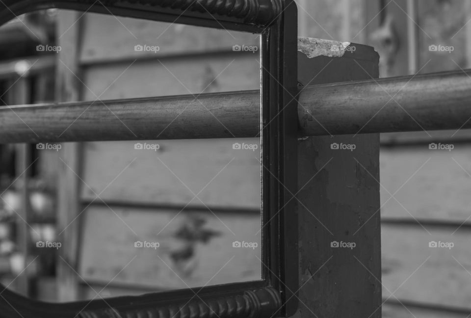 A black and white picture of reflection in a mirror, "connecting the line".