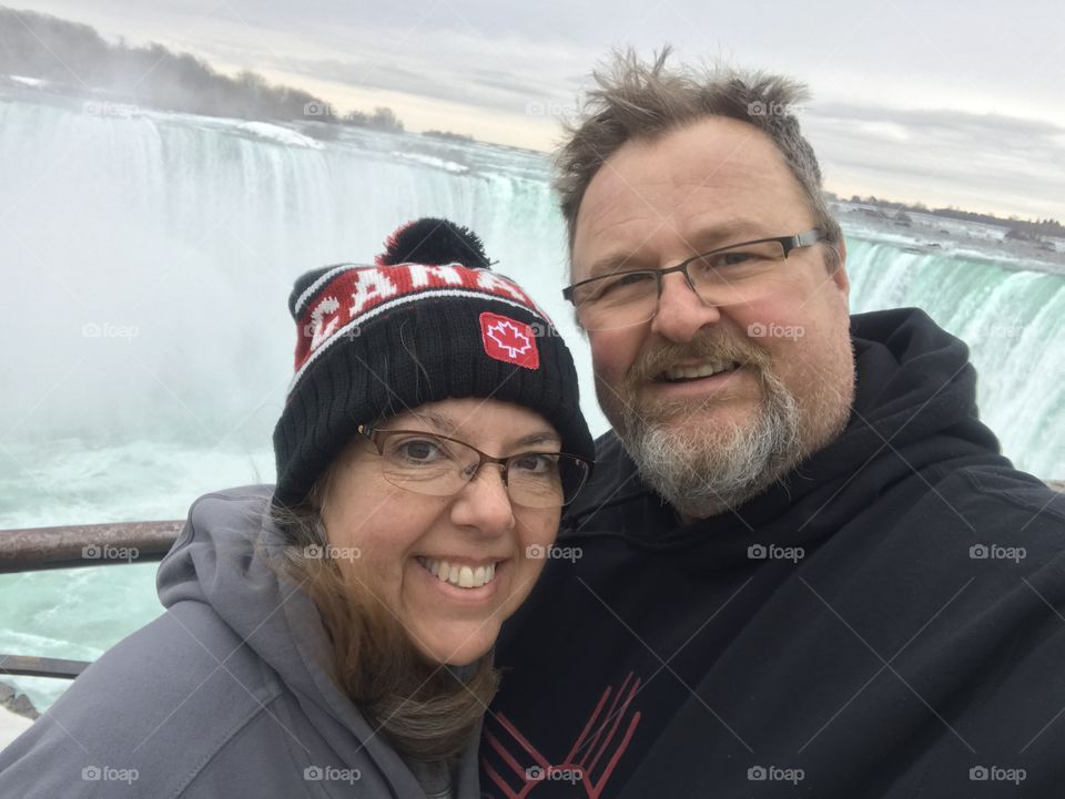 Couple at Niagara Falls in winter 