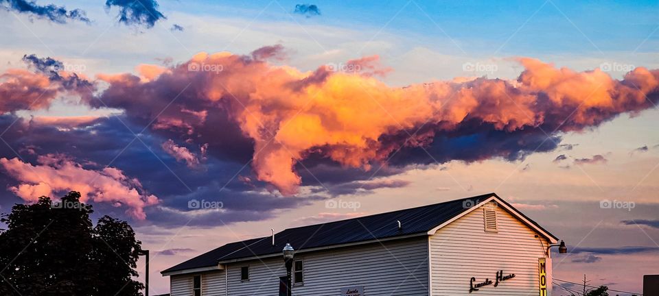 sunset with clouds and building