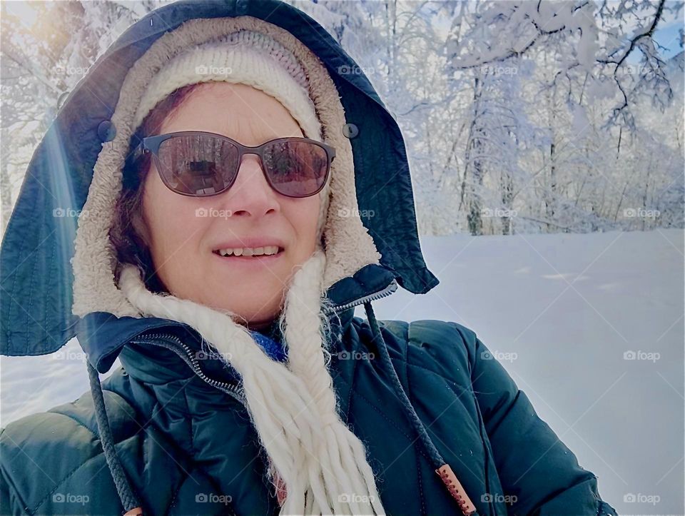 This lady is dressed for the cold weather so she can enjoy her time in “Kochel am See”, “Kochel at the Lake”, a small town north of the “Alps” in “Bavaria”, Germany. It is also known for its natural hot geyser springs. 2024. Hypnotic Productions