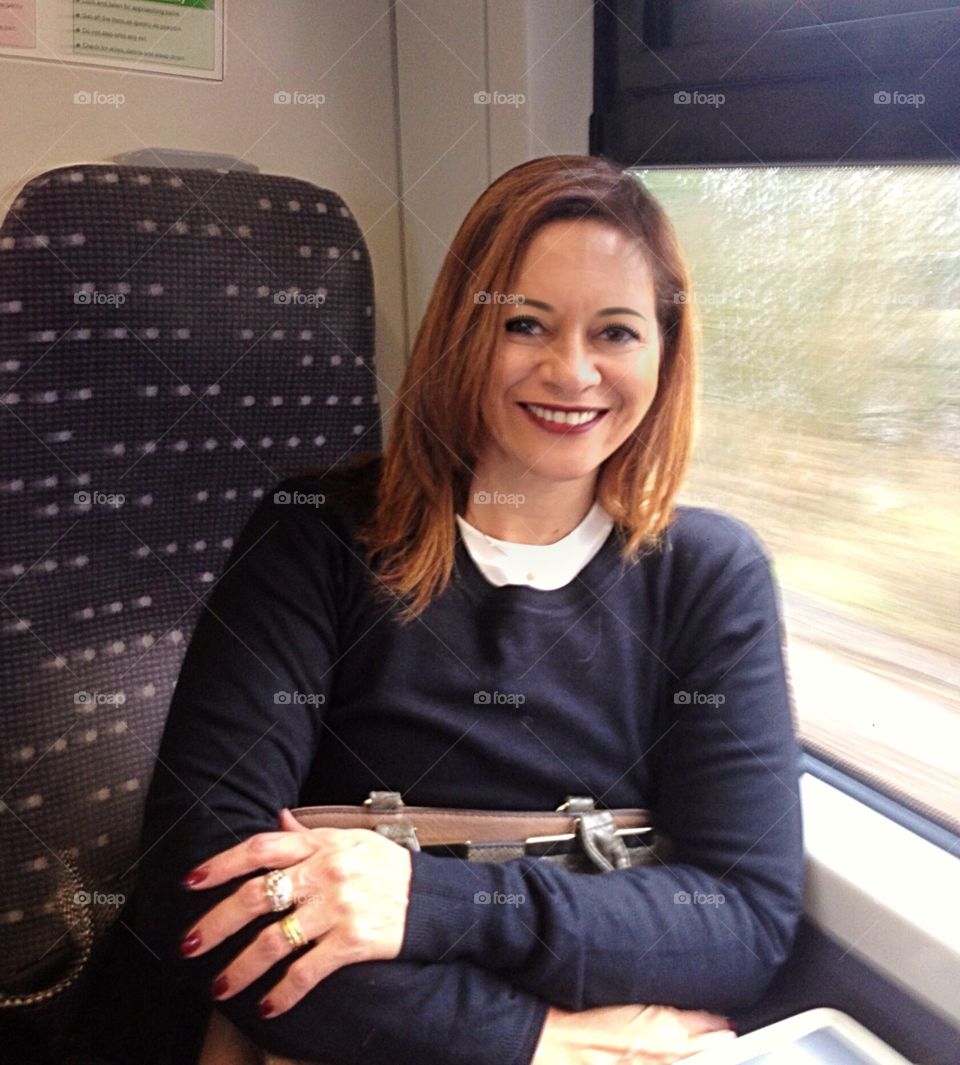 Woman traveling by train.