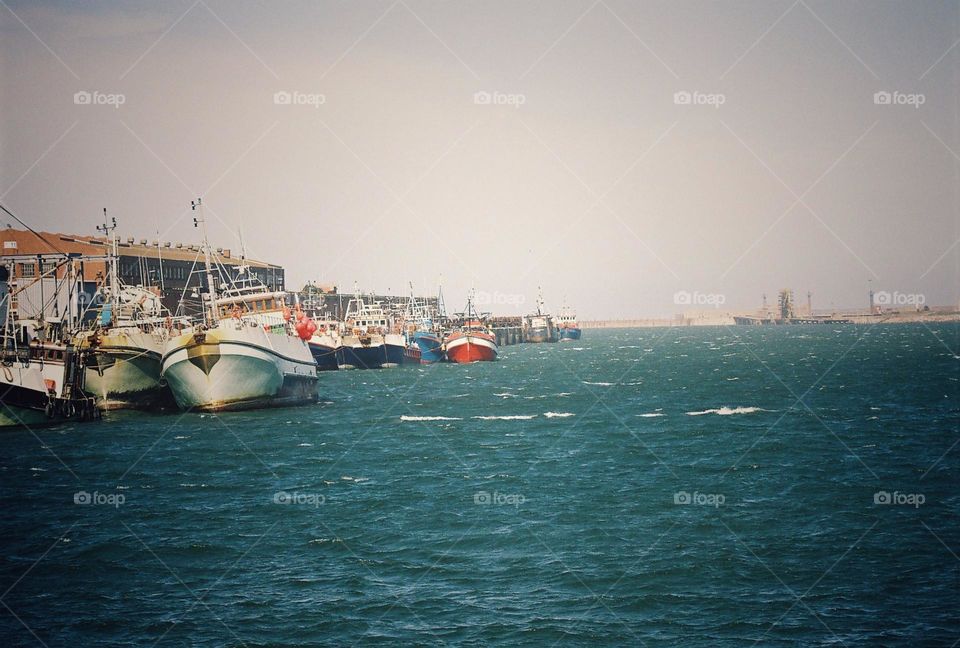 boat's in the harbor,rough seas