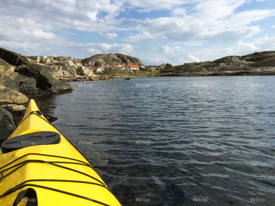 close-up of yellow kayak by the sea coastline