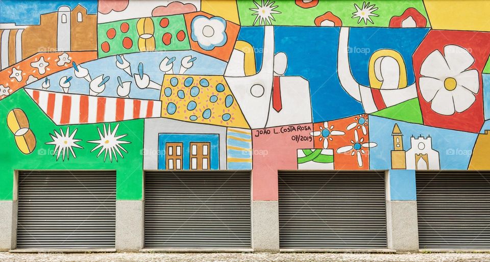Colourful street art celebrating the Festas Dos Tabuleiros in Portugal 