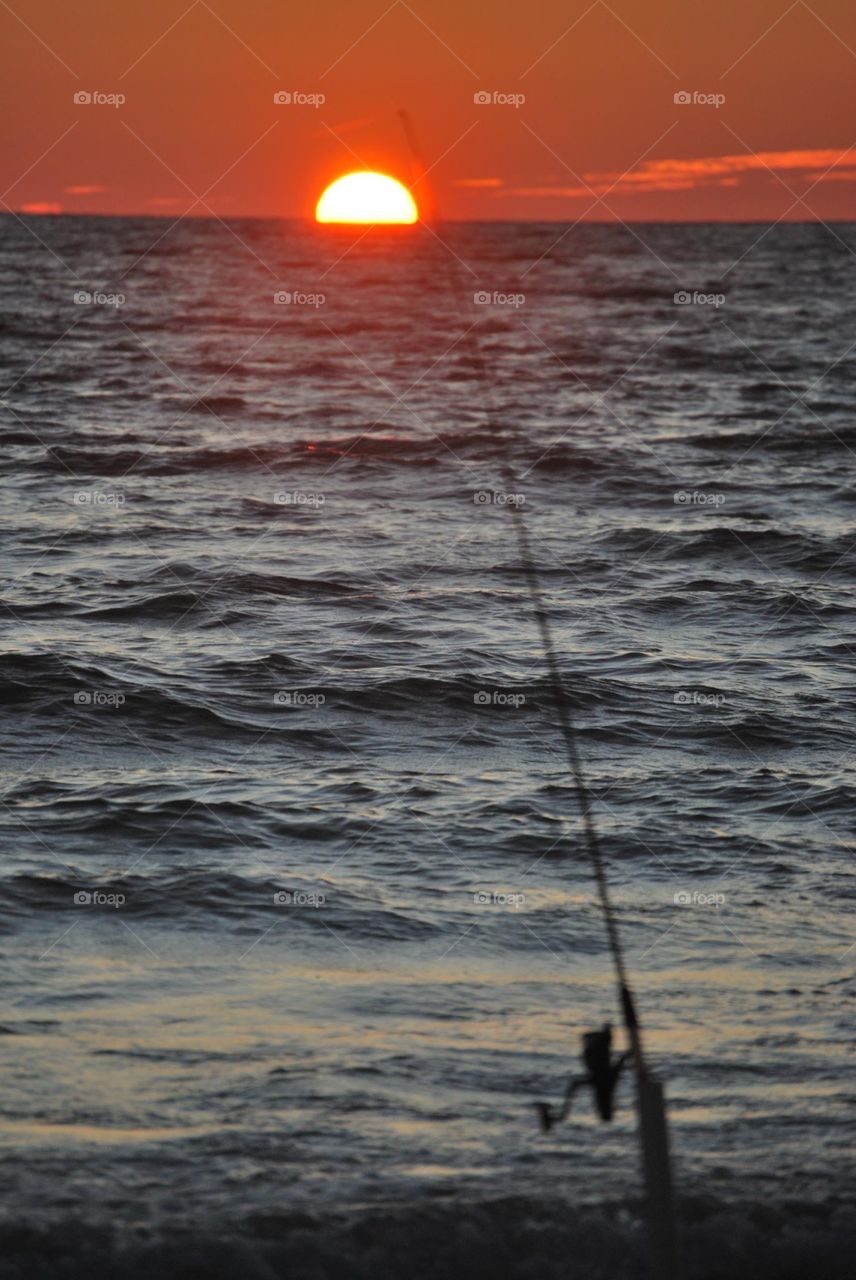Fishing pole at sunset 