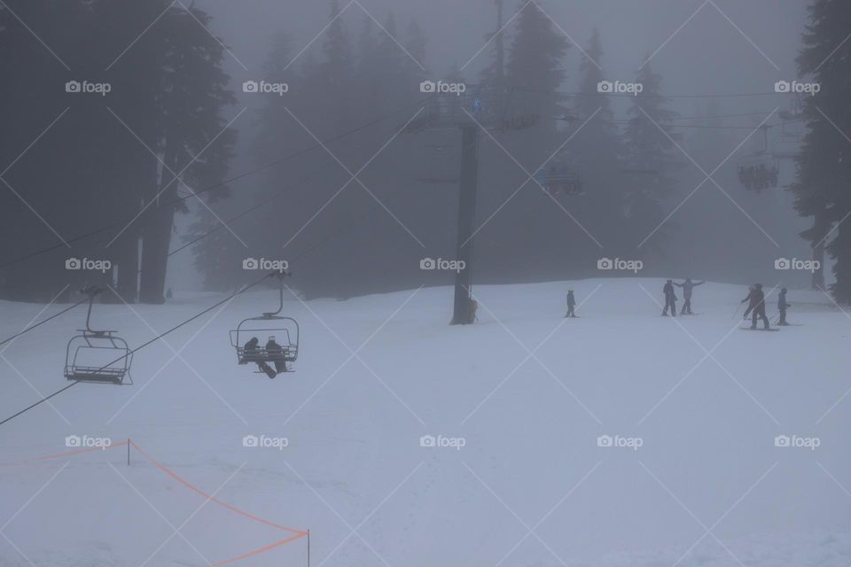 Chair lift in fog