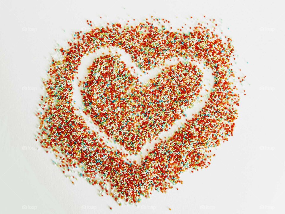 heart formen with hundreds and thousands. with sugar pearls