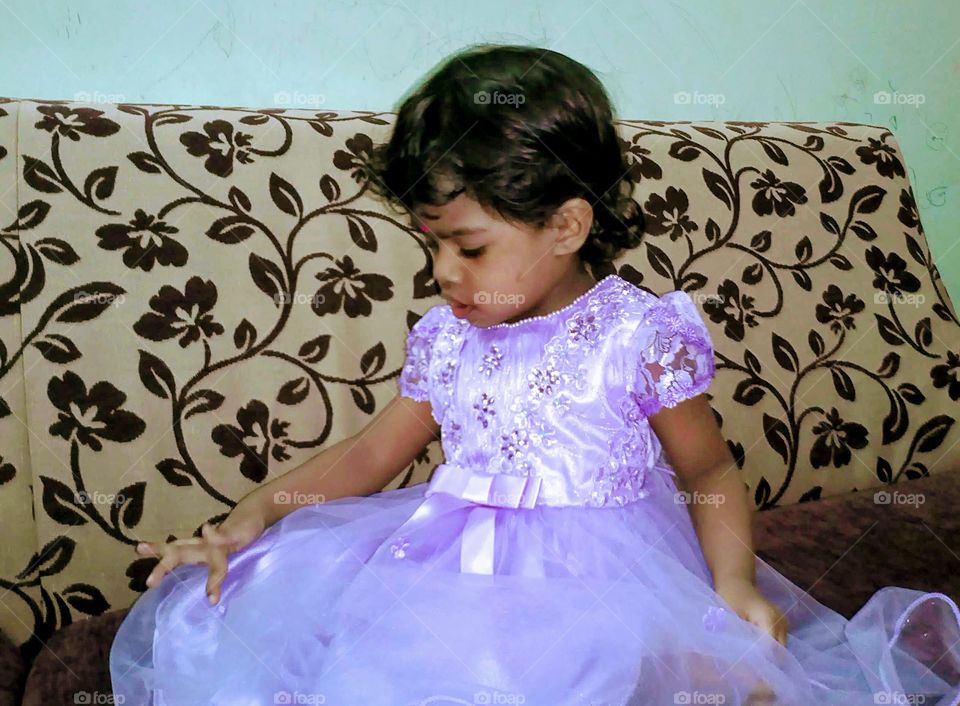 Little girl in violet dress