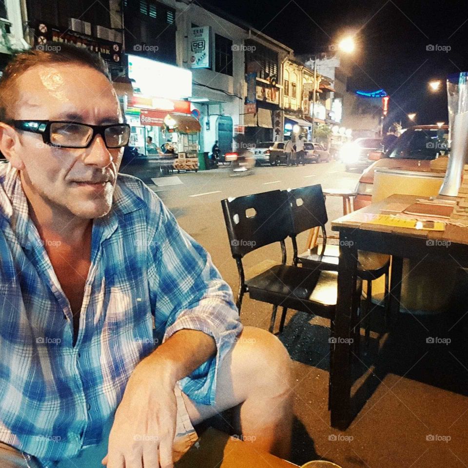 Man at restaurant on street.