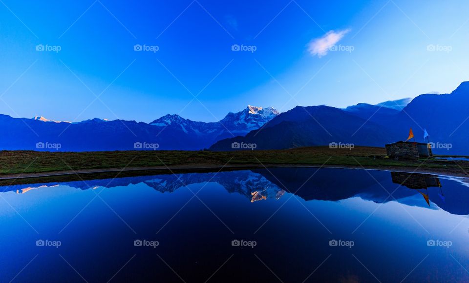 reflection of beautiful mountains on the lake water creating Serene epic views