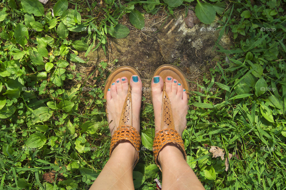 Top-down view of standing outside in the summer. 