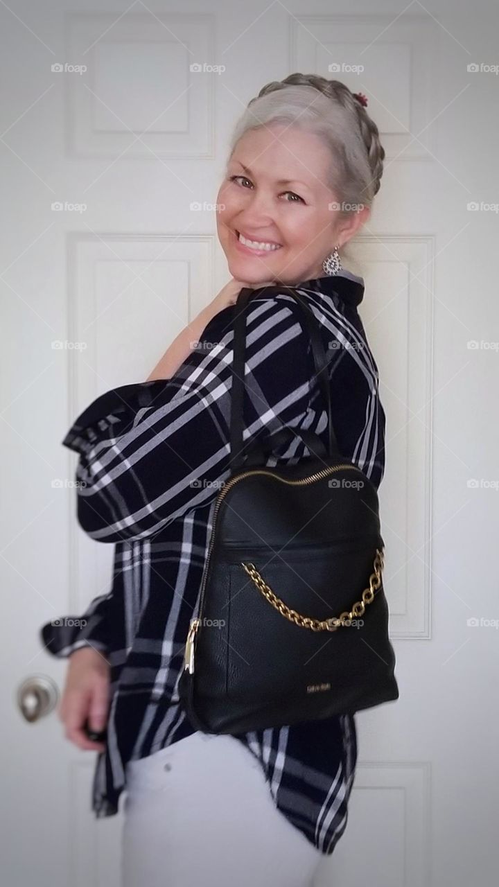 Me smiling at home with a Backpack Purse