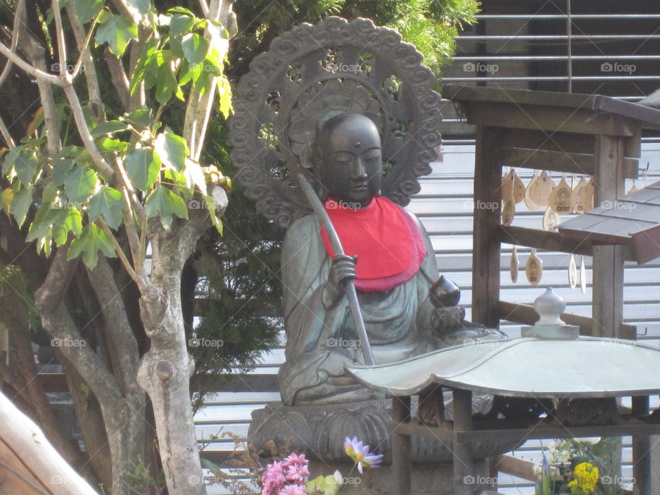 Asakusa Kannon. Tokyo, Japan. Sensoji Buddhist Temple and Gardens.  Buddha Statue with Umbrella.