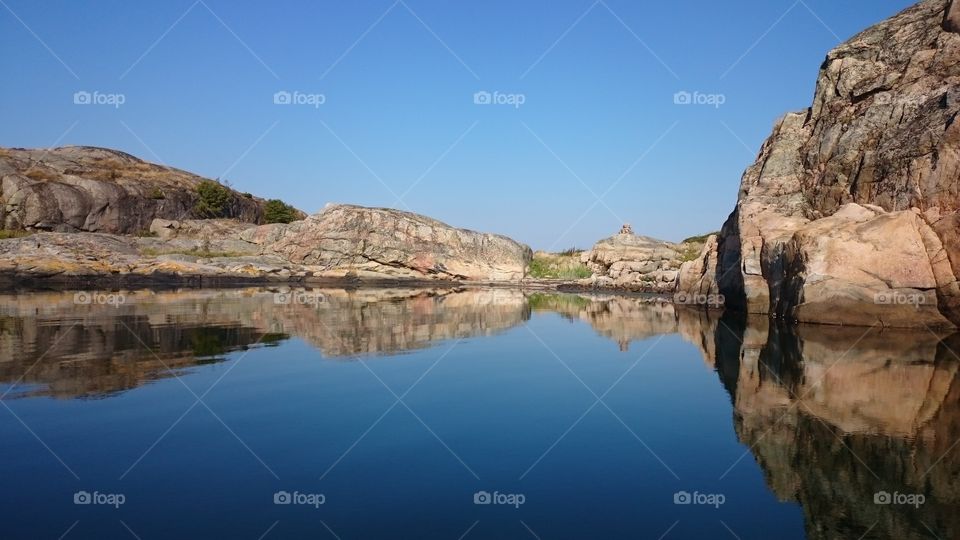 Rock reflecting in sea