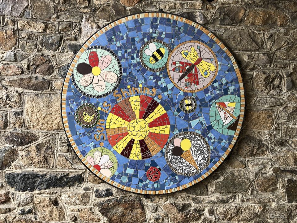 A delightful mosaic adorning the walls of this olde worlde craft Centre.in Bovey Tracey in Devon.