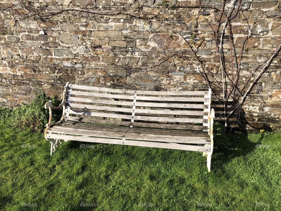A very authentic seat that can be found in the grounds of a large acreage of land on a country Cornwall estate in the UK.