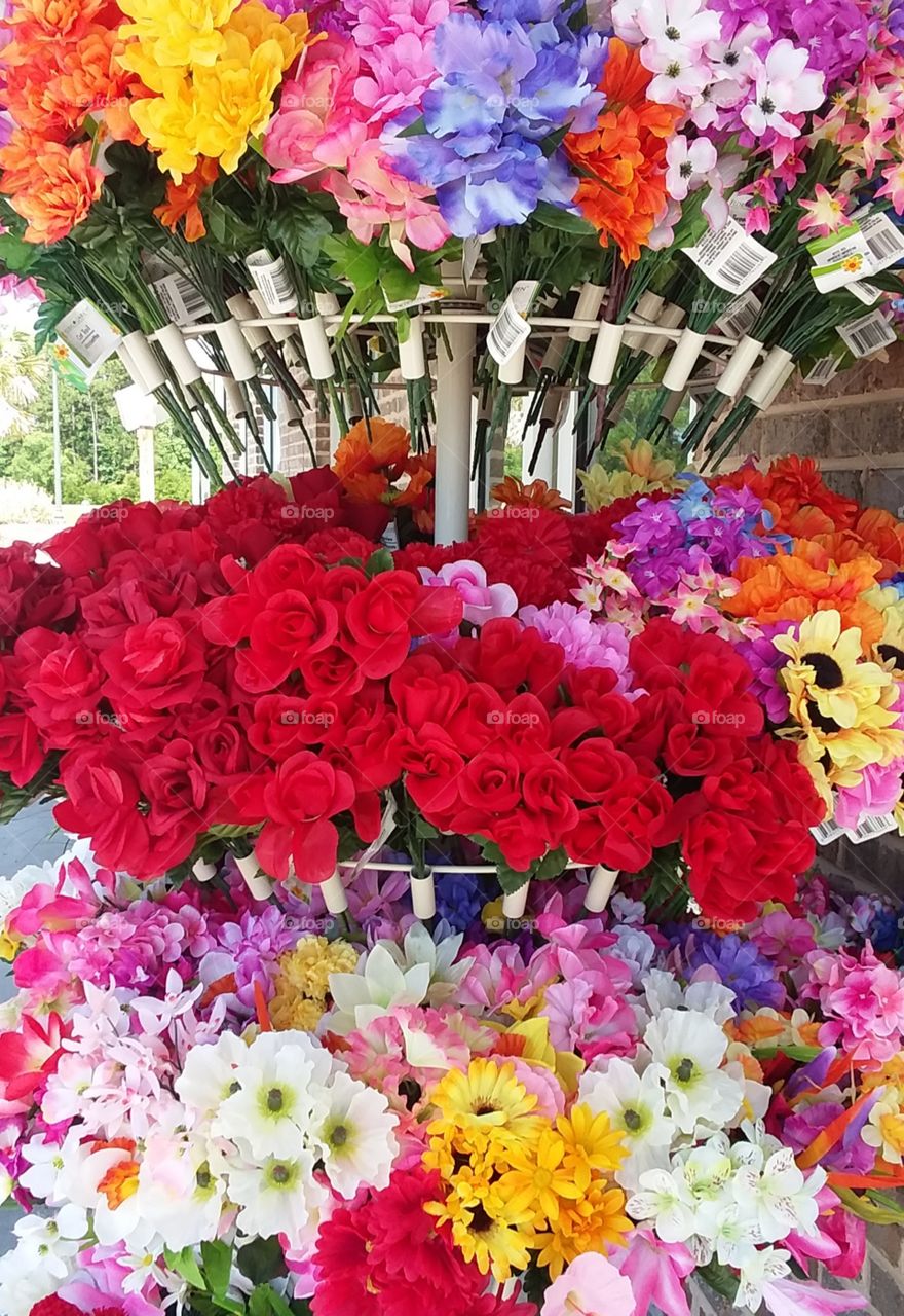 brightly colored bouquets of flowers outside of store