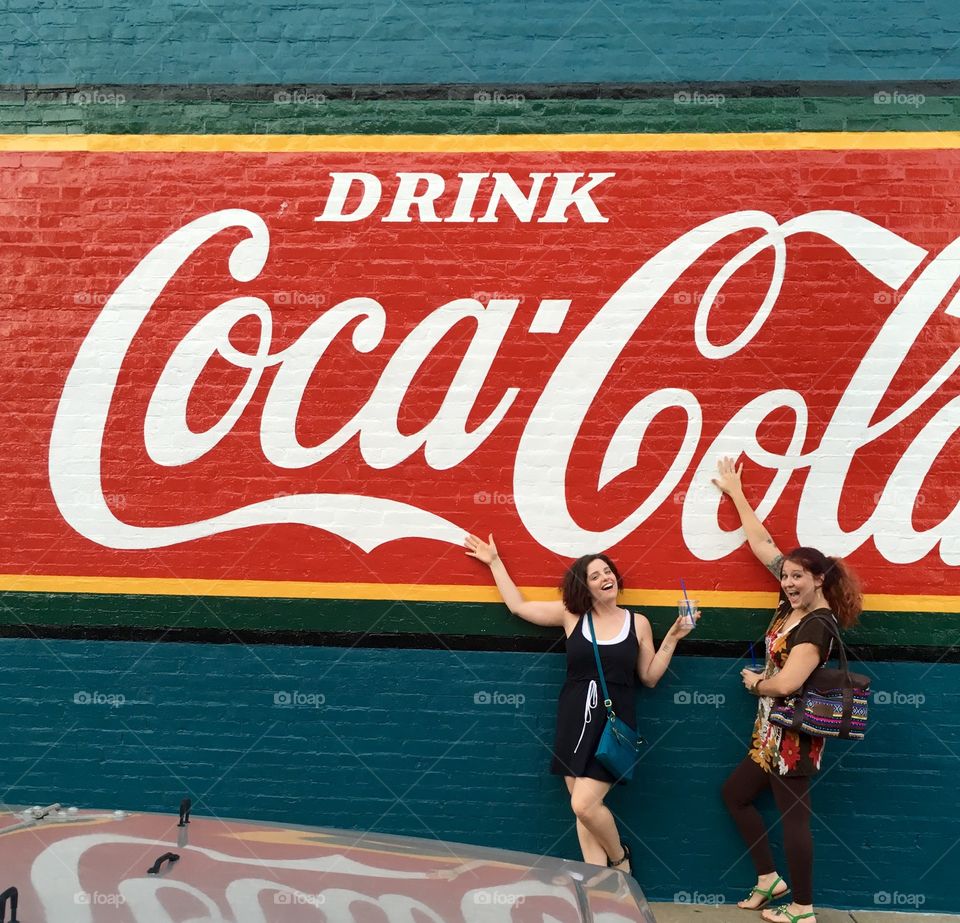 Friends at a Coca-Cola mural