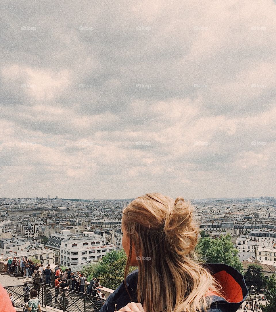 Girl overlooking Paris, France from Monte Marte