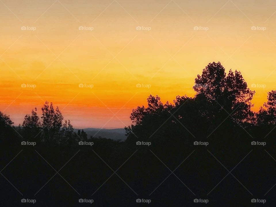 The sky as the sunrises giving way to a beautiful array of colors to start the day.