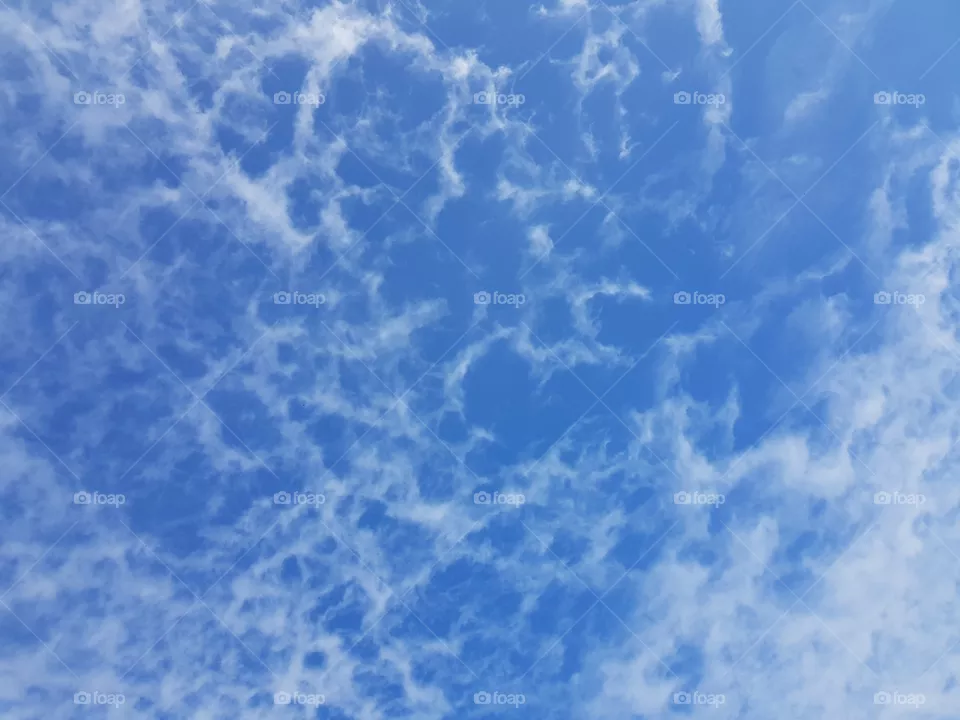 Blue sky and fluffy clouds