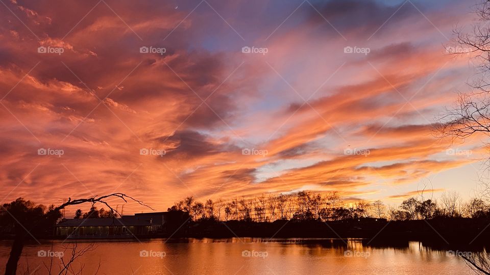 Due to a Cold Airmass Front and the clouds parted late at sunset. As the sun sets deeper Colors form shapes and abstracts colors across sky. One Beautiful Sunset-Twilight OMG.