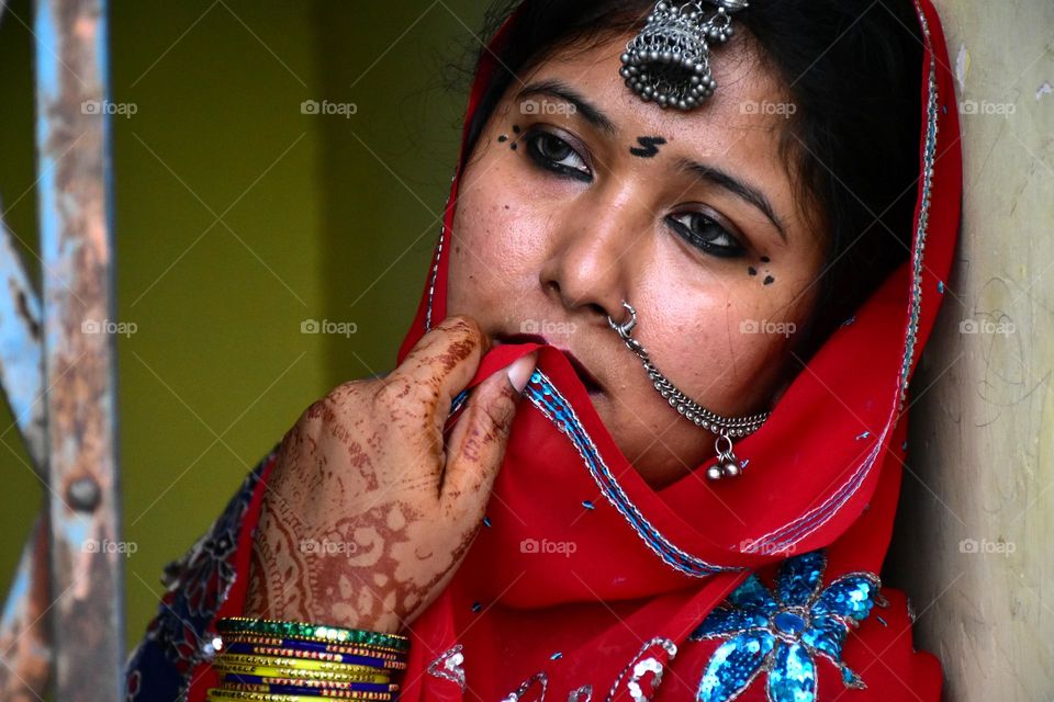 Rajasthani woman wearing traditional clothes and jewelry