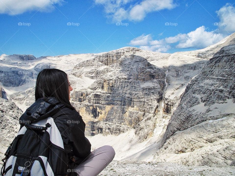 Woman get a Sight . A woman is taking a rest in high mountain