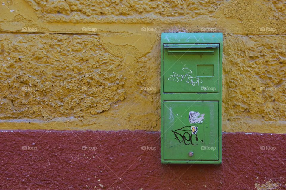 A green public mailbox outside the San Miguel de Allende, Mexican Post Office.
