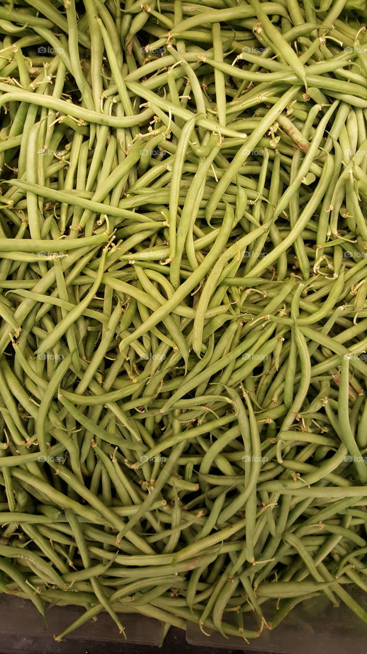 Long green beans on retail display