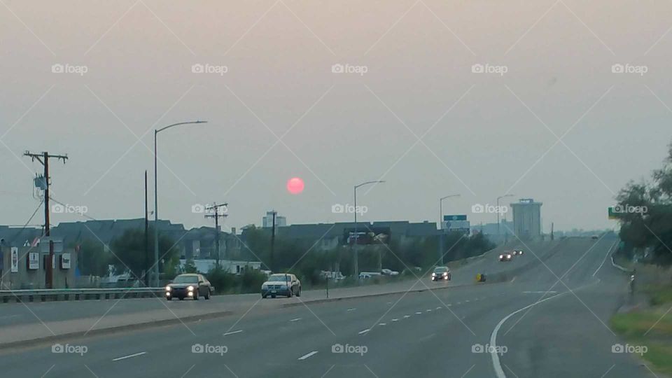 The Sun is red because of the wild fires in surrounding states