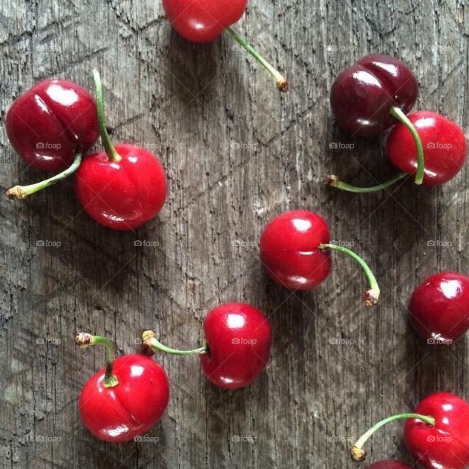 Cherry Wood. Fresh, red Bing Cherries on distressed barn wood 