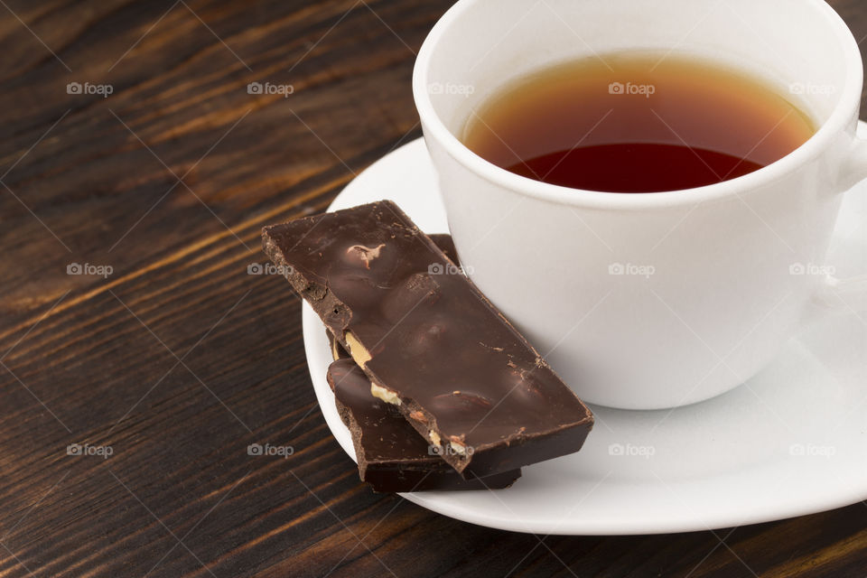 close up view of coffee cup and chocolate