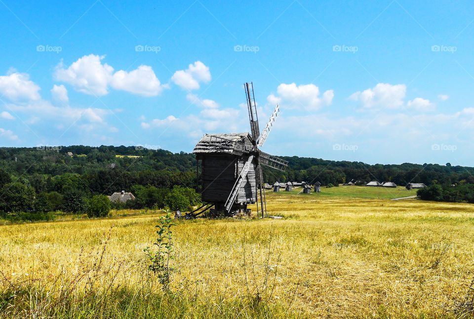 A Beautiful Landscape with A Wooden Windmill