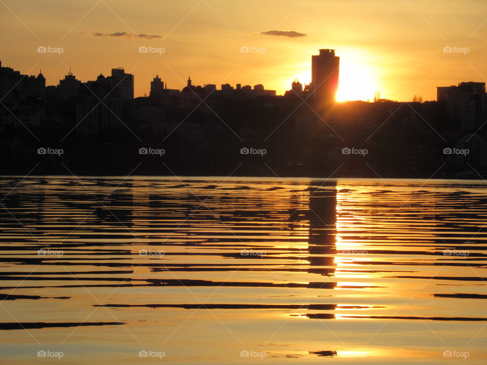 sunset over the city across the river