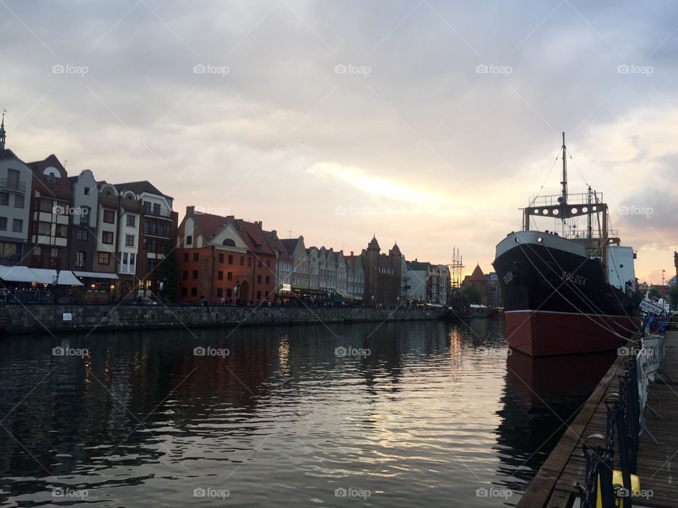 Sunset over Gdansk canal and tied up ship